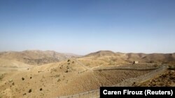 A soldier stands guard along the border fence outside the Kitton outpost on the border with Afghanistan in North Waziristan (file photo)