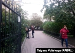 Museum Director Natalya Ashimbayeva disputes the notion that the proposed site (above) is a "square" at all, calling it a vacant lot that is used primarily as a smoking space by local students.
