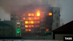 A local media building called the Press House is set ablaze following a gun battle with Chechen insurgents in the regional capital, Grozny, on December 4.