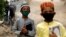 Boys wearing protective masks head to the madrasah in Karachi in July.