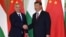 Hungarian Prime Minister Viktor Orban (left) shakes hands with Chinese President Xi Jinping during a visit to Beijing in 2019. 