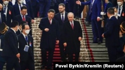 Xi and Russian President Vladimir Putin attend a reception in Moscow on March 21.