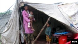 Flood victims forced to live in a temporary shelter in Muzaffarabad in the Pakistani administered Kashmir region