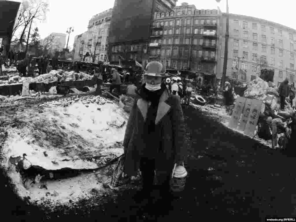 Viktor, a 25-year-old businessman, says he's tired and eager for the opposition to reach an agreement with President Yanukovych. For the time being, he stays busy distributing food and tea.