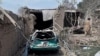 A man inspects damaged houses near the site where a suicide bomber detonated explosives in a truck in the northren province of Balkh on August 25.