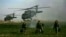 FILE: U.S. army special forces walk in a field as Blackhawk helicopters transporting NATO officers land in Marjah's Balakino Bazar neighborhood in 2010.
