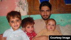 Rasool Dawar with his children.