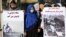 FILE: Afghan women activists hold banners highlighting alleged Taliban atrocities. 