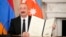 U.S. - Azerbaijan President Ilham Aliyev holds a signed trilateral agreement during a ceremony with Armenian Prime Minister Nikol Pashinian and President Donald Trump at the White House, August 8, 2025.