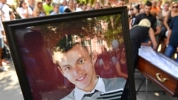 'People Should Be Held Responsible': Mother Of Dead Belarusian Demands Criminal Inquiry