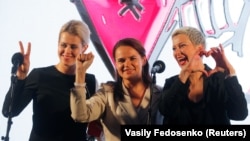 Veranika Tsapkala (left to right), Svyatlana Tsikhanouskaya, and Maryya Kalesnikava attend an election campaign rally in Minsk in July 2020.