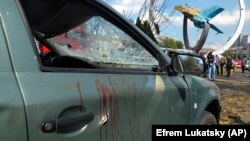 Blood stains are seen on a damaged car after a deadly Russian missile attack in Vinnytsya on July 14.