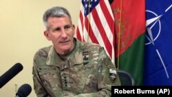 FILE: John Nicholson, the top American commander in Afghanistan, speaks to reporters at Bagram air base north of Kabul in March.