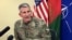 FILE: John Nicholson, the top American commander in Afghanistan, speaks to reporters at Bagram air base north of Kabul in March.