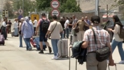 As Tehran Residents Flee, Numbers Surge At Iran's Border With Armenia