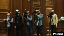 Armenia - Cameramen and a photojournalist follow a session of the Armenian parliament, Yerevan, April 18, 2023.