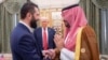 In this photo released by the Saudi Royal Palace, President Donald Trump (center) watches Saudi's Crown Prince Muhammed bin Salman (right) shake hands with Syria's interim President Ahmad al-Sharaa in Riyadh on May 14.