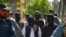 Afghan security forces escort alleged Islamic State fighters being presented to the media at the police headquarters in Jalalabad on May 29. They included one Iranian citizen.