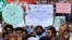 Supporters of Khalid Khan, the man who killed Tahir Nasim, who was in court on blasphemy charges, protest in Peshawar on July 31.