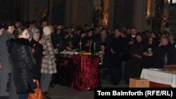 Mourners gathered in the western Ukrainian city of Lviv on February 22 for an emotional church service to mark the death of 29-year old local activist and historian Bohdan Solchanyk, who died in this week's violence in Kyiv.