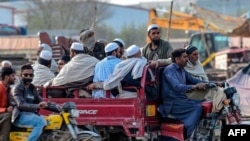 FILE: Worshippers leave a Tablighi Ijtema or religious gathering in Raiwind on the outskirts of Lahore on March 13.