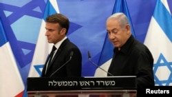 Emmanuel Macron și Beniamin Netanyahu, în Israel, octombrie 2023.