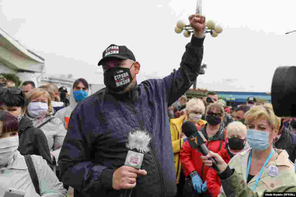 Tsikhanouski gestures during the Minsk protest.&nbsp;Police often shut down such protests but did not intervene this time. HRW said more than 120 Belarusian protesters, opposition bloggers, journalists, and other government critics were arrested by the authorities between May 6-13.