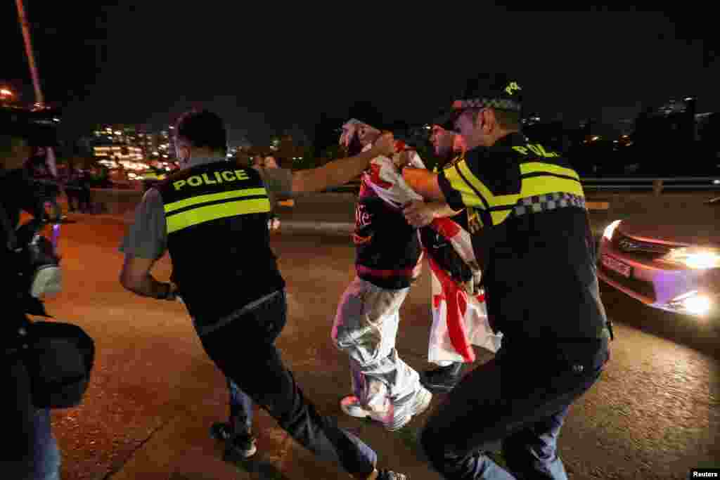 A man is led away by police during the largely peaceful protest on May 2. The EU&rsquo;s foreign policy arm earlier this month criticized Georgian Dream&rsquo;s decision to reintroduce the law, which it said &ldquo;raises serious concerns&rdquo; around media freedom in the country -- something it called &ldquo;crucial for the EU accession process.&rdquo;