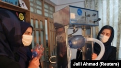 Members of the Afghan all-female robotics team work on an open-source, low-cost ventilator in Herat Province.
