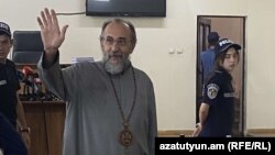 Armenia - Archbishop Mikael Ajapahian greets supporters during his trial in Yerevan, August 28, 2025.