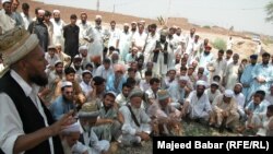 A Pashtun tribal leader addressing a jirga near the Khyber Pass.