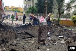 At least 40 people were killed in two car-bomb attacks that Turkey blames on Syrian intelligence.