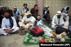 Members of the Helman peace march rest in Kabul on June 18.