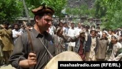 A drummer celebrates spring in a Kalash village.