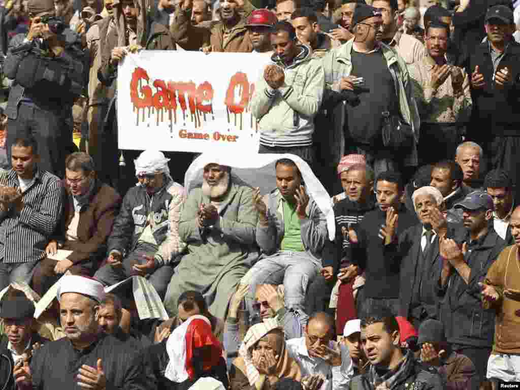 Opposition supporters attend Friday Prayers on Tahrir Square in Cairo.