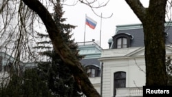 The national flag of Russia flies above Moscow's embassy in Prague (file photo)