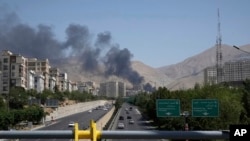 Iran - Smoke rises from an oil storage facility in Tehran after it appeared to have been struck by an Israeli strike, June 16, 2025.