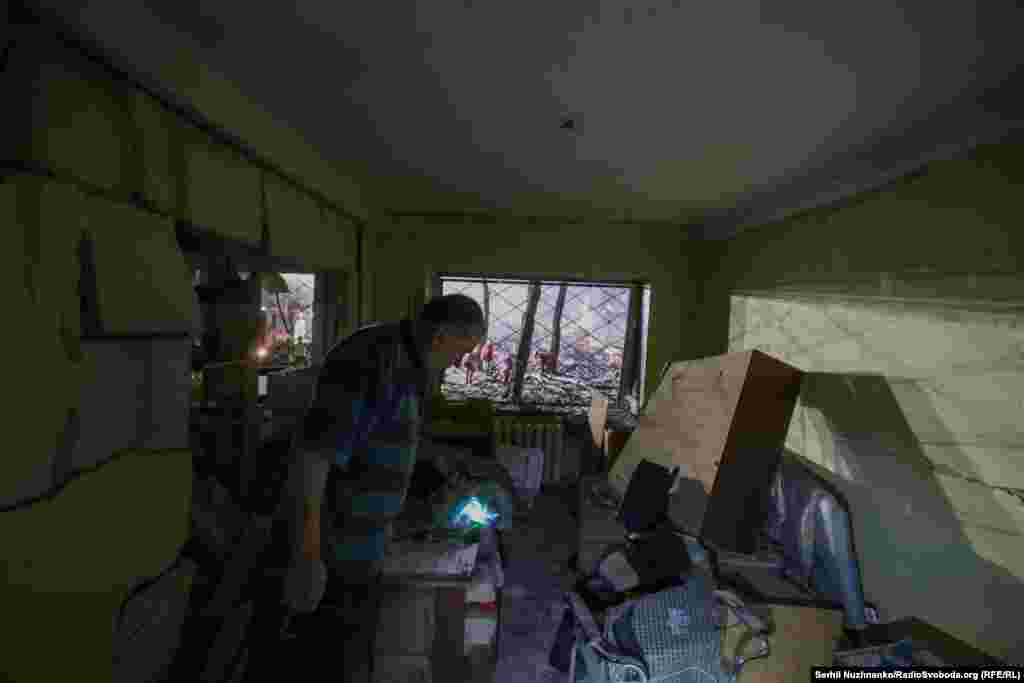 A resident surveys the damage to his apartment in Kyiv.