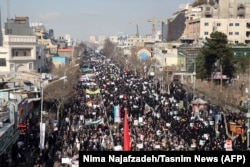 Iranian pro-government supporters march during a rally in support of the regime in the city of Mashhad late last week.