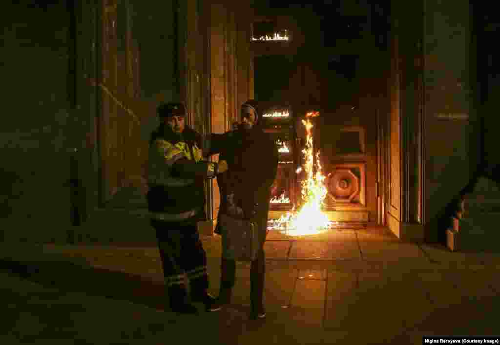 Once detained, the two friends were driven away in a black Mercedes to a police station. Beroyeva remembers investigators questioning them through the night "using different interrogation techniques, sometimes they would threaten to charge us with being accomplices.... It was scary, I felt very vulnerable. I'm not used to that kind of situation." At 7 a.m., after being questioned through the night, the pair was released.