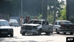 Investigators work at the scene of a bomb blast in Georgia's volatile breakaway region of Abkhazia. Much of the ethnic tensions that pervade the post-Soviet space can be attributed to Stalin-era nationalities policies. 