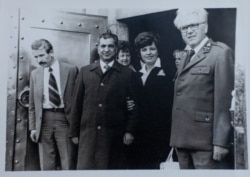 Karmal (second left) with Jiri Jelinek (right), the state forest director for the Kraslice region, near Sindelova in 1978-79.
