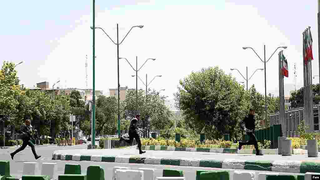 Iranian police run into position near Tehran's parliament building. &nbsp;
