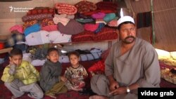 Each day, Ghulam Ali walks to a nearby square with his tools and waits for women and children to bring him shoes to repair so he can feed his family of eight.
