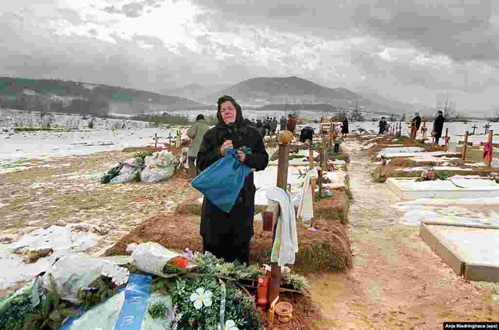 Melica Saric, a Bosnian Serb mother, mourns at the grave site of her son Velimir on December 24, 1995, in Sarajevo. He was killed near the end of the war in October near the front line of Sarajevo's Serb-held suburbs.