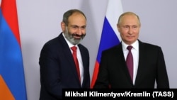 Russia is wary as Armenia readjusts its foreign policy -- and its relations with Moscow. Here, Russian President Vladimir Putin meets with Armenian Prime Minister Nikol Pashinian in Moscow on June 13. They meet again in the Russian capital on September 8.