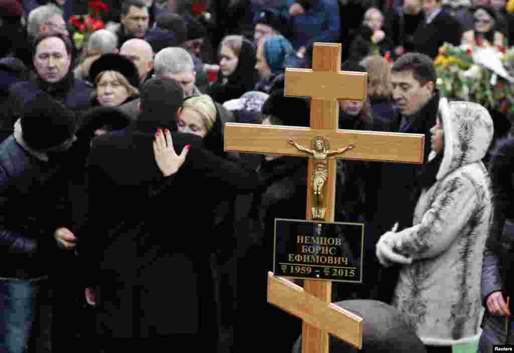 Mourners gather near Nemtsov's grave.