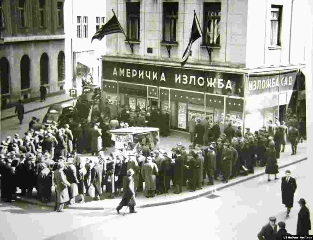 Locals in Belgrade line up outside a "U.S. Information Center" to read newspapers reporting the death of Stalin in 1953. &nbsp; &nbsp;