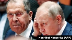 Володимир Путін та Сергій Лавров у Берліні на конференції з мирного врегулювання конфлікту в Лівії, 19 січня 2020 року