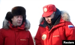 Russian President Vladimir Putin (right) and Prime Minister Dmitry Medvedev visit the remote Arctic islands of Franz Josef Land on March 29.